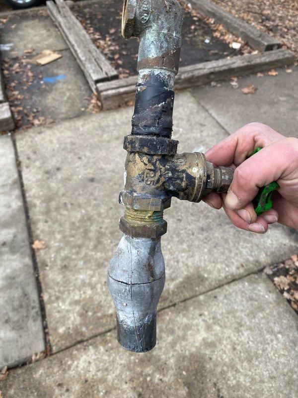 Completed replacement of severely corroded copper supply pipe and failed brass shut-off valve that showed significant oxidation and mineral buildup. Installed new 90-degree elbow fitting with brass valve components and connected to existing plumbing, ensuring proper sealing and function at connection points within the wall cavity.