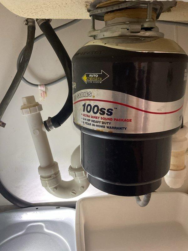 Inspected kitchen sink with reported slow drainage issue. Found minor buildup in the P-trap and drain lines connected to the 3/4 HP garbage disposal (model 100ss). Cleaned and cleared blockage, restoring proper drainage functionality to the kitchen sink.