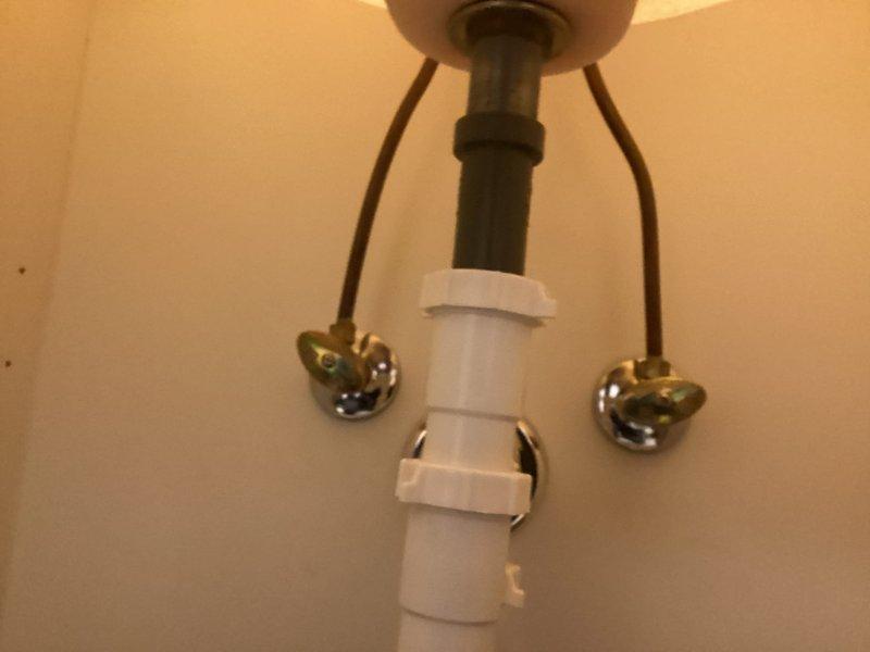 Inspected Moen bathroom sink faucet and discovered the screw holding the handle mechanism is stripped and unable to be removed without damaging internal gears. Removal would require cutting, which would compromise the fixture's functionality. Customer will obtain a replacement faucet from manufacturer and schedule a follow-up installation service.