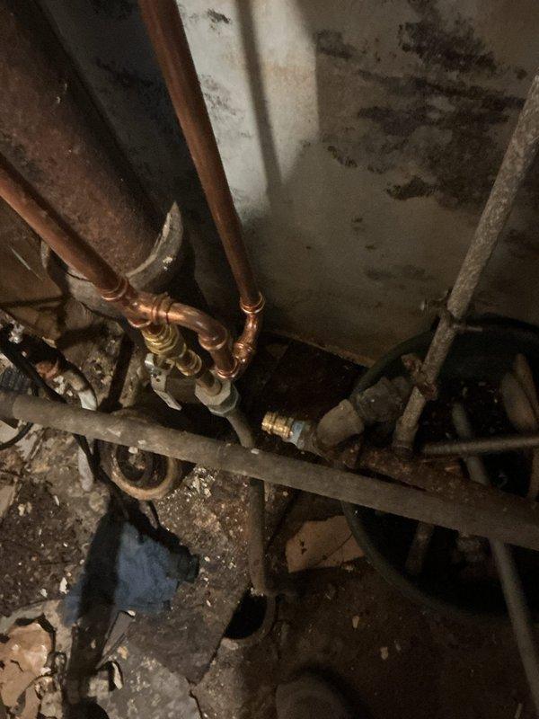 Inspected low water pressure issue affecting two faucets following previous repair work. Found significant corrosion in copper supply lines and evidence of moisture damage on surrounding walls. Cleaned sediment from affected lines and replaced corroded pipe sections to restore proper water flow to all fixtures.