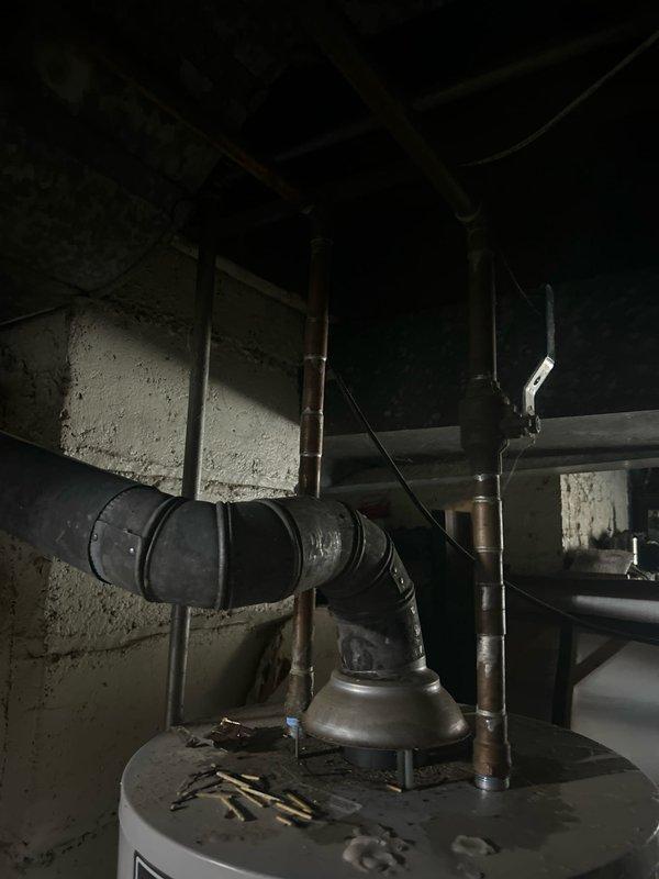 Inspected 40-gallon Bradford White water heater (installed 2013) after customer reported pilot light failure. Diagnostic assessment confirmed pilot light will not remain lit, indicating potential thermocouple or gas valve failure. Recommended replacement due to age and condition of unit.