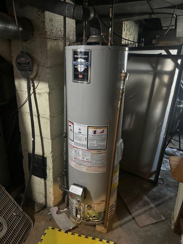 Inspected 40-gallon Bradford White water heater (installed 2013) after customer reported pilot light failure. Diagnostic assessment confirmed pilot light will not remain lit, indicating potential thermocouple or gas valve failure. Recommended replacement due to age and condition of unit.