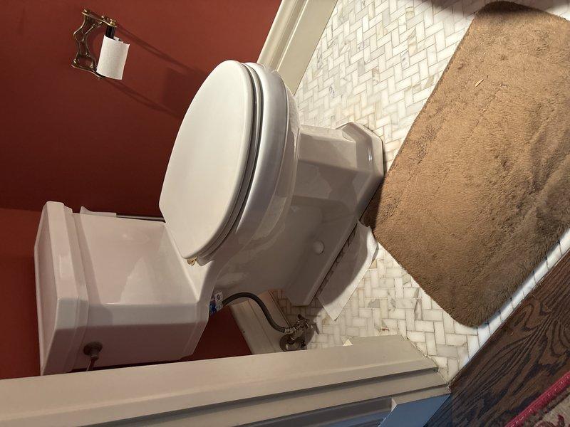 Performed comprehensive bathroom plumbing service including replacement of toilet wax ring to address sewer odor issues, conducted smoke test to verify seal integrity, rebuilt toilet internal components, and repaired leaking faucet and exterior spigot. Visual inspection confirmed proper installation and function of all repaired fixtures.