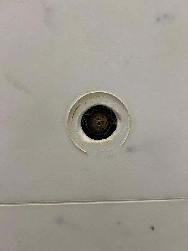 Replaced deteriorated drain assembly in bathroom sink to restore proper drainage function. Repaired leaking showerhead valve in master bathroom by replacing worn gaskets and tightening connections. Reinstalled disconnected p-trap assembly on secondary bathroom sink with new compression fittings to prevent leaks.
