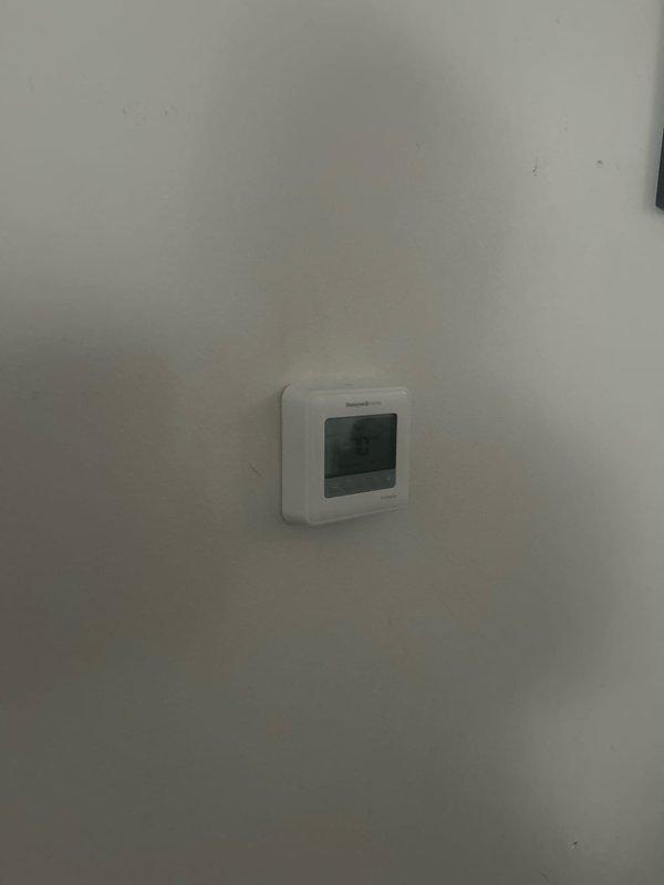 Responded to service call regarding boiler with recurring error code 501 causing intermittent hot water loss and requiring constant resets. Performed diagnostic inspection of the boiler system, including copper pipe network, circulation pump, and connected components. Examined digital thermostat settings and operation to resolve the persistent error condition.