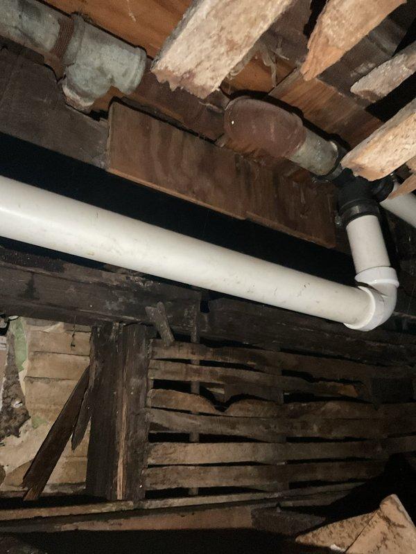 Responded to afternoon service call for a broken cast iron drain pipe located between first and second floor bathrooms. Upon inspection, identified significant corrosion and failure in the existing cast iron waste line. Completed full replacement of the damaged section with new PVC drain pipe, including proper installation of elbow joints and connections to existing plumbing. Work included accessing the affected area through wall openings and ensuring proper alignment of the new drainage system between both floor units.
