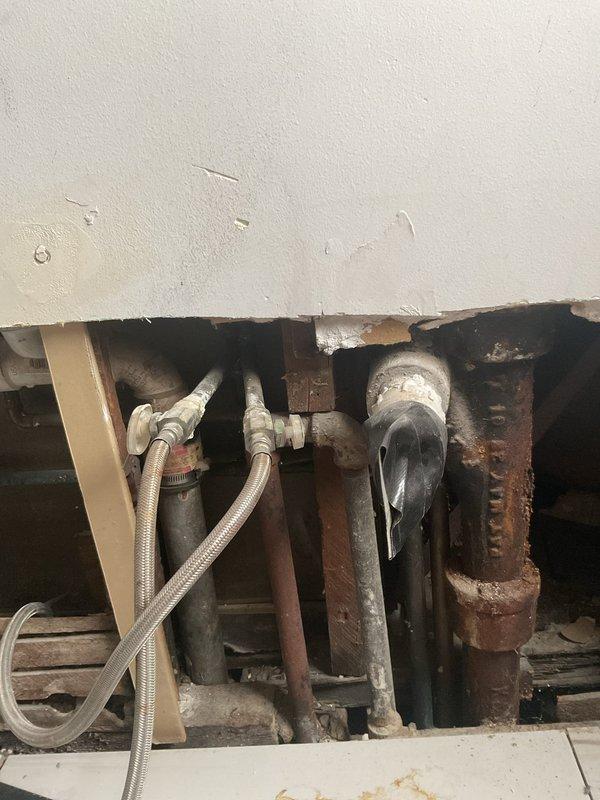 Responded to afternoon service call for a broken cast iron drain pipe located between first and second floor bathrooms. Upon inspection, identified significant corrosion and failure in the existing cast iron waste line. Completed full replacement of the damaged section with new PVC drain pipe, including proper installation of elbow joints and connections to existing plumbing. Work included accessing the affected area through wall openings and ensuring proper alignment of the new drainage system between both floor units.