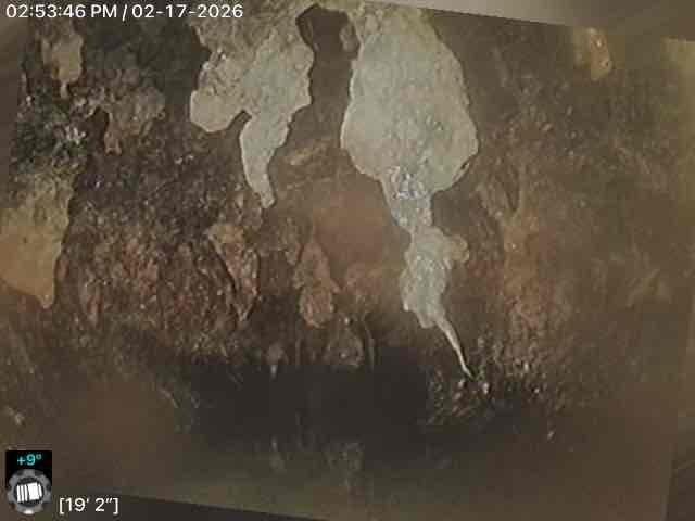 Inspected wall area showing significant moisture damage with visible deterioration, peeling, and possible mold formation. Documented extensive structural compromise with measurement readings of 19'2" and 22'0" in affected sections. Photos taken to record condition for further assessment of required remediation.