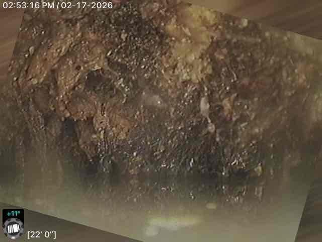 Inspected wall area showing significant moisture damage with visible deterioration, peeling, and possible mold formation. Documented extensive structural compromise with measurement readings of 19'2" and 22'0" in affected sections. Photos taken to record condition for further assessment of required remediation.