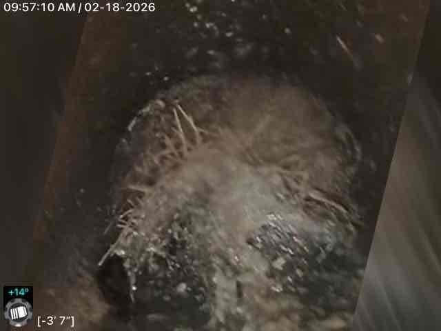 Performed scheduled VIP maintenance on tanked water heater and conducted video inspection of outside clean out. Inspection camera revealed pipe with some mineral buildup along edges and walls at 9'8" depth, as well as crystalline formations at approximately 3'7" depth with temperature readings between +11° and +14°.