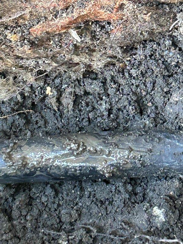 Responded to emergency service call for a burst pipe in the basement utility area. Located and excavated the damaged pipe section which showed significant water leakage and surrounding soil saturation. Replaced the compromised pipe section and installed a new PVC drainage system with connections to the floor basin, along with a digital pump controller to prevent future flooding issues.