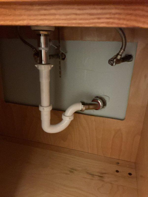 Performed rodding service on bathroom sink and tub drains to clear clogs. Inspected and replaced customer-supplied bathroom faucet. Observed water damage on cabinet floor beneath sink and documented condition of toilet tank components.