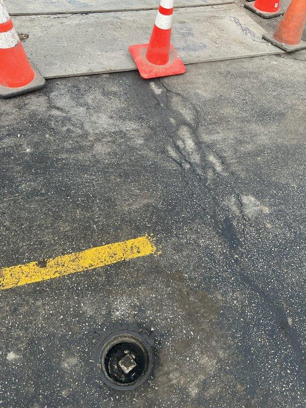 Responded to commercial kitchen drainage issue requiring assessment for hydrojetting service. Inspected two floor drains in food service area showing signs of clogging. Evaluated external drainage access point and set up safety cones to prepare for potential service area.