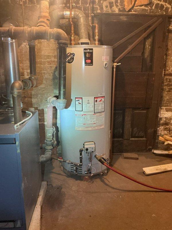 Performed scheduled maintenance on Bradford White tanked water heater per afternoon appointment request. Conducted thorough system flush to remove sediment buildup and inspected all connections, valves, and venting components. Confirmed proper operation of unit with functional exhaust flue and verified integrity of copper supply lines and fittings.