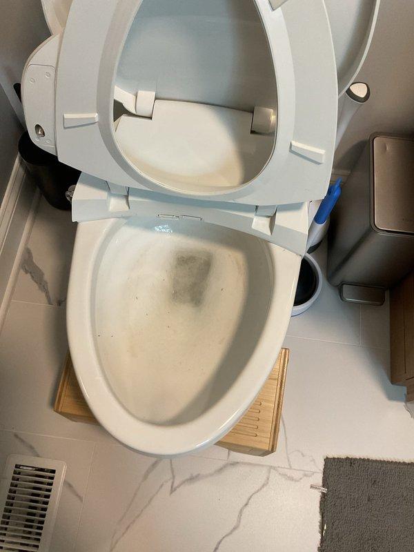 Responded to service call for a slow-draining toilet reported to have been an issue for 2 days. Upon inspection, found and cleared a minor blockage in the toilet trap. Verified proper drainage and function after service was completed.