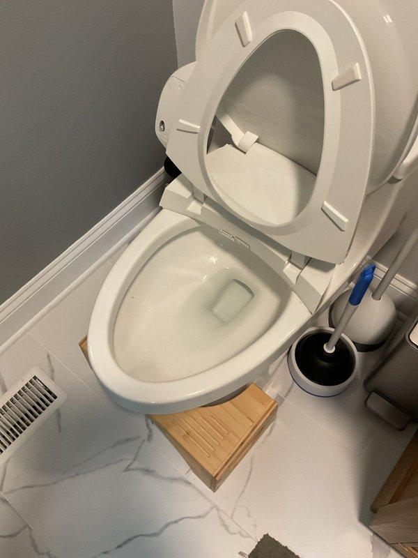Responded to service call for a slow-draining toilet reported to have been an issue for 2 days. Upon inspection, found and cleared a minor blockage in the toilet trap. Verified proper drainage and function after service was completed.