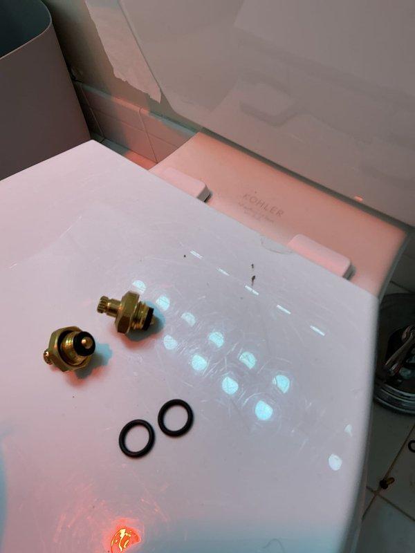 Completed shower valve repair originally sold by technician. Removed faulty valve assembly from tiled wall enclosure, replaced worn O-rings and brass fittings, and reinstalled properly. Ensured proper function and verified no leaks after installation.