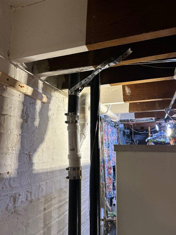 Responded to a service call for a clogged sink, where customer required Spanish communication. Upon inspection, found deteriorated P-trap assembly with compromised drainage connections. Cleared the clog using professional equipment and replaced damaged PVC drain components, ensuring proper connection to the main vertical waste stack in basement. All work was completed after customer approved the estimate on-site.
