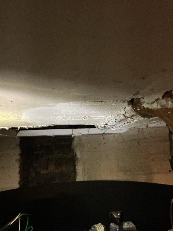 Responded to no hot water complaint at 10-unit condo building with approximately 4-5 year old water heater. Upon inspection, discovered significant ceiling damage indicating water leakage from plumbing system. Identified compromised PVC piping with purple primer marks and examined gas valve connections to diagnose and resolve the hot water supply issue.