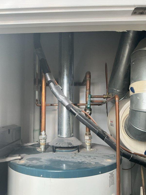 Removed and replaced existing 2004 Rheem 75-gallon gas water heater which was no longer providing hot water. Installed new 75-gallon water heater with drain pan and circulation pump according to manufacturer specifications. Completed proper venting connections and verified all plumbing connections for leaks and proper operation before departure.