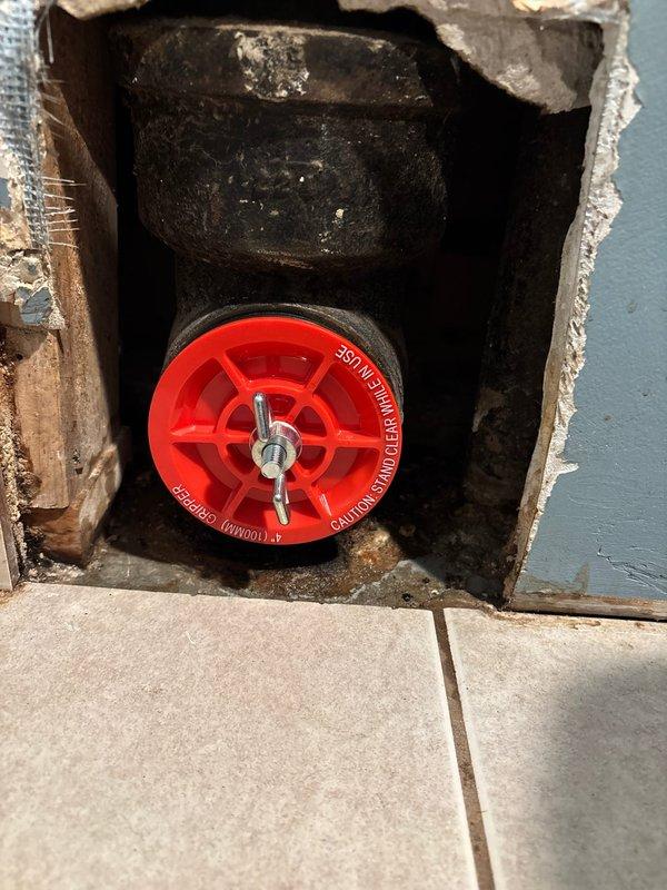 Responded to emergency service call regarding persistent leak following previous service. Upon inspection, discovered deteriorated valve assembly with significant mineral buildup and water damage in wall access point. Replaced faulty shut-off valve, installed new seal, and verified proper operation with no leaks present.