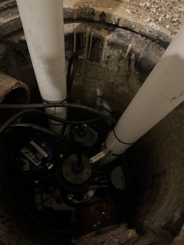 Responded to warranty service for previously installed ejector pump that had failed, causing basement flooding. Replaced defective pump unit and verified proper installation in the sump basin with appropriate discharge pipe connections. System is now functioning correctly with proper water evacuation.