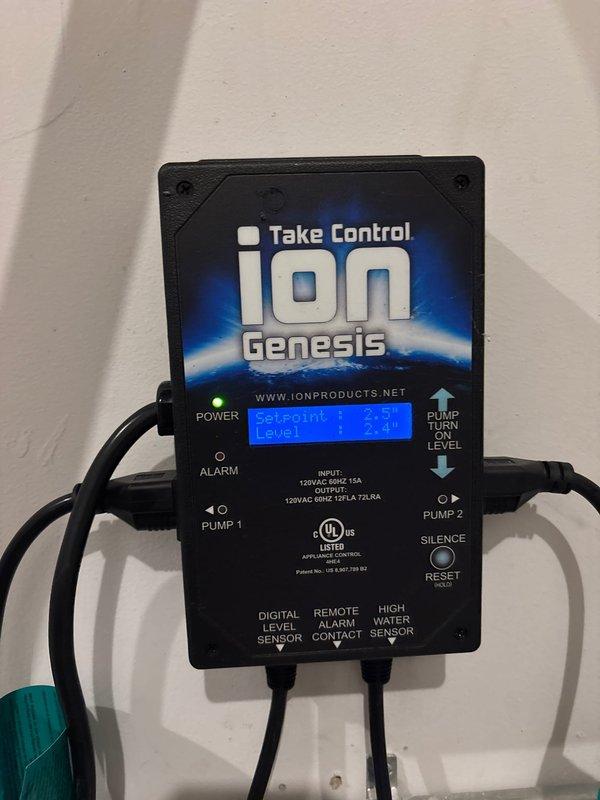 Inspected and evaluated existing sump pump system with Ion Genesis controller, documented current conditions showing 2.3" water level reading. Scheduled return visit to install 35 ACI controller and high water switch to enhance system reliability and provide additional protection against potential basement flooding.