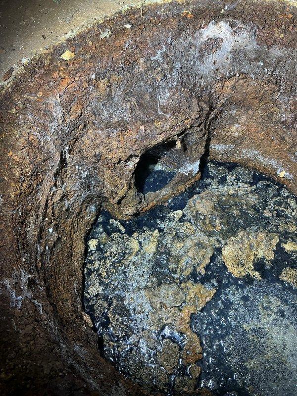 Conducted basement inspection to provide estimate for complete piping replacement. Identified severely corroded metal pipes with significant deterioration including visible holes, advanced rust, and water damage to surrounding concrete walls. Documented extensive pipe system degradation requiring full replacement due to age and moisture exposure.
