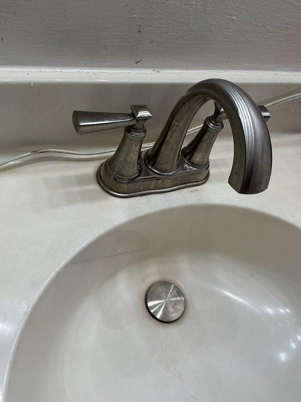 Responded to service call for bathroom sink leak and slow drainage issue. Upon inspection, identified and repaired faulty drain assembly connection causing water leakage beneath sink. Additionally, cleared clog in drain pipe to restore proper drainage function, ensuring complete resolution of both reported problems.