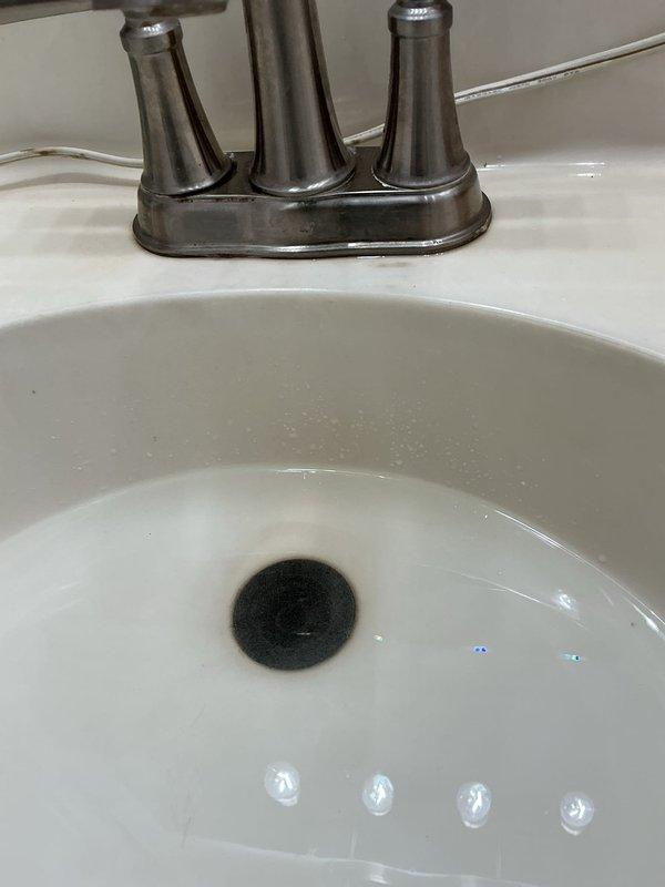 Responded to service call for bathroom sink leak and slow drainage issue. Upon inspection, identified and repaired faulty drain assembly connection causing water leakage beneath sink. Additionally, cleared clog in drain pipe to restore proper drainage function, ensuring complete resolution of both reported problems.