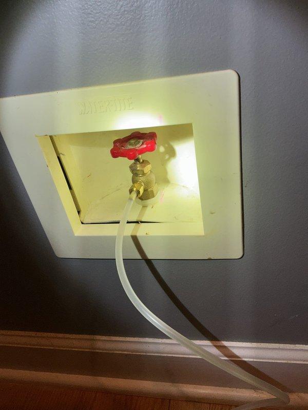 Completed scheduled icebox replacement service as arranged. Installed new water shutoff valve with access panel in wall, connecting flexible supply line to fixture. Inspected existing plumbing system including PVC drainage and copper supply lines, confirming proper integration with new components.