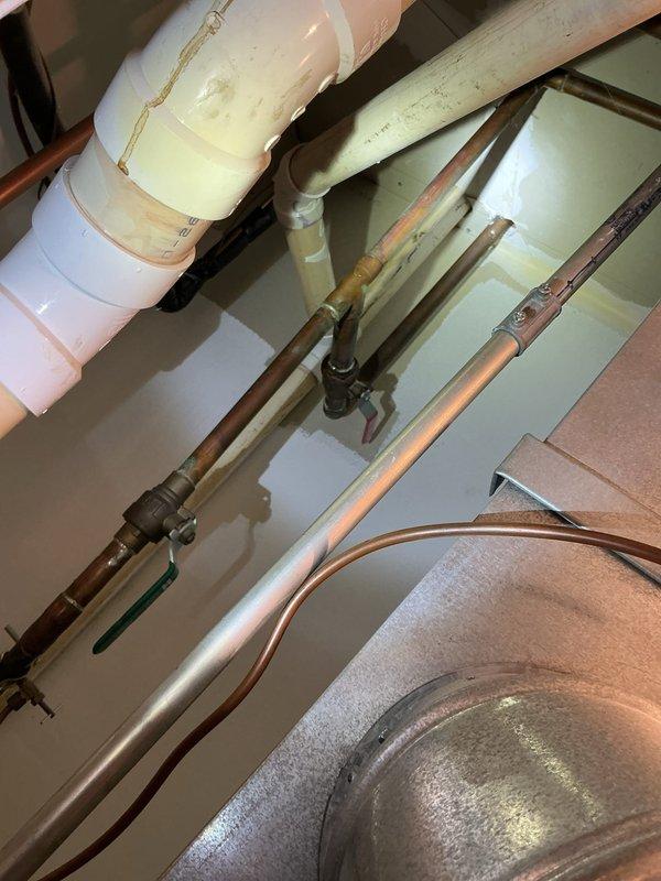 Completed scheduled icebox replacement service as arranged. Installed new water shutoff valve with access panel in wall, connecting flexible supply line to fixture. Inspected existing plumbing system including PVC drainage and copper supply lines, confirming proper integration with new components.