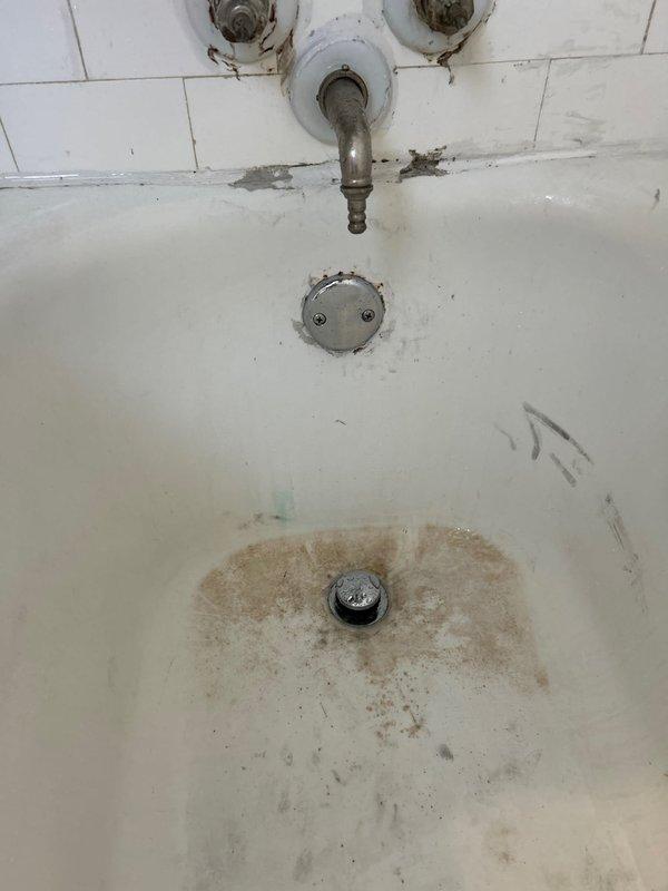 Completed repair of deteriorated plumbing system identified during initial assessment by Jared. Work included replacement of corroded drain assembly in bathroom sink which showed significant mineral buildup and staining. Additionally, addressed PVC drainage issues in the utility access area where vertical pipes showed signs of wear and surrounding concrete exhibited deterioration.