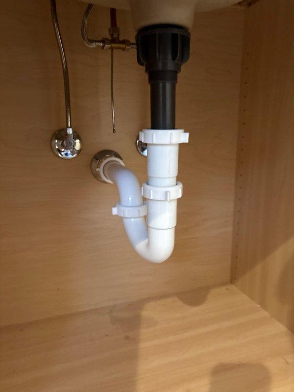 Responded to service call for disconnected drain connector that had fallen into pipe affecting sink and bath drainage. Upon inspection, found and retrieved the detached connector from the plumbing system. Successfully reattached the drain connector to both fixtures, securing all PVC P-trap components and verifying proper alignment of the drain assembly. Tested drainage system after repair with no leaks observed and proper water flow confirmed.