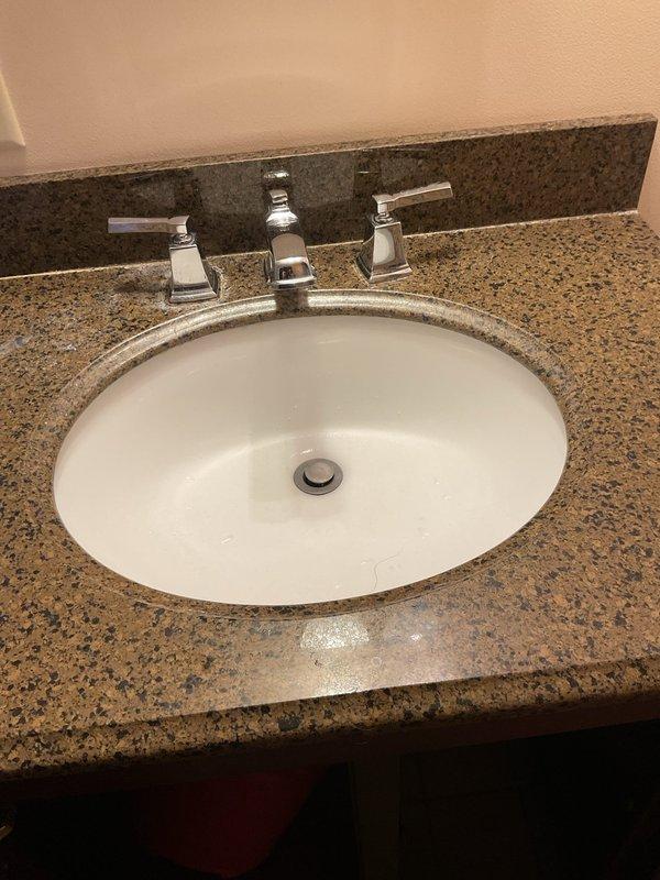 Responded to service call for multiple slow drains affecting kitchen sink, bathroom sink, and tub. Inspected bathroom sink plumbing and under-sink cabinet area to diagnose drainage issue. Successfully cleared blockage in all affected fixtures, restoring proper drainage throughout the home.