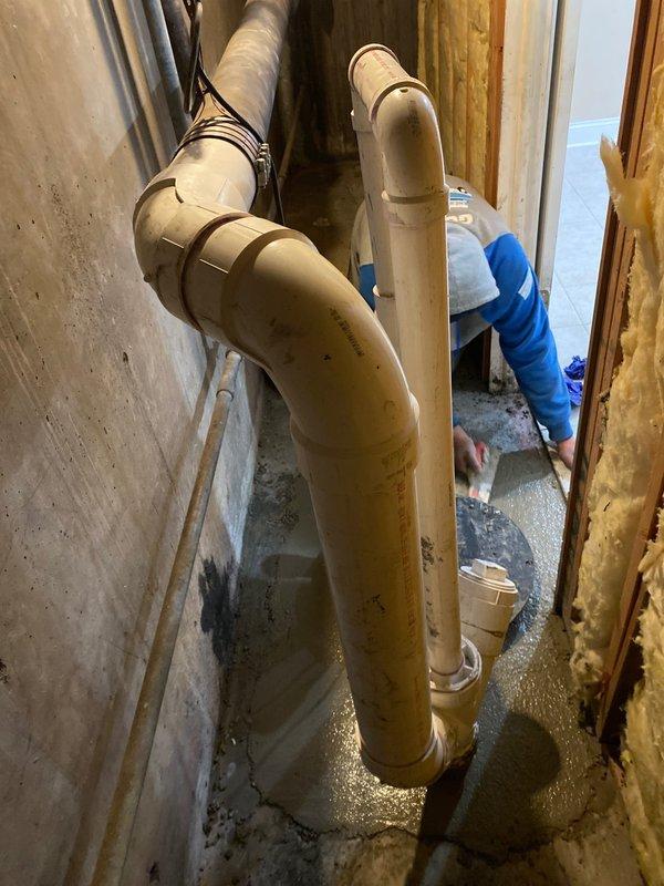 Inspected drainage system in unfinished basement area, documented PVC pipe installation and concrete substrate condition. Identified significant floor deterioration with visible cracking and fragmentation. Client has paid initial deposit, with additional work scheduled to address the drainage issues and restore damaged concrete surfaces.