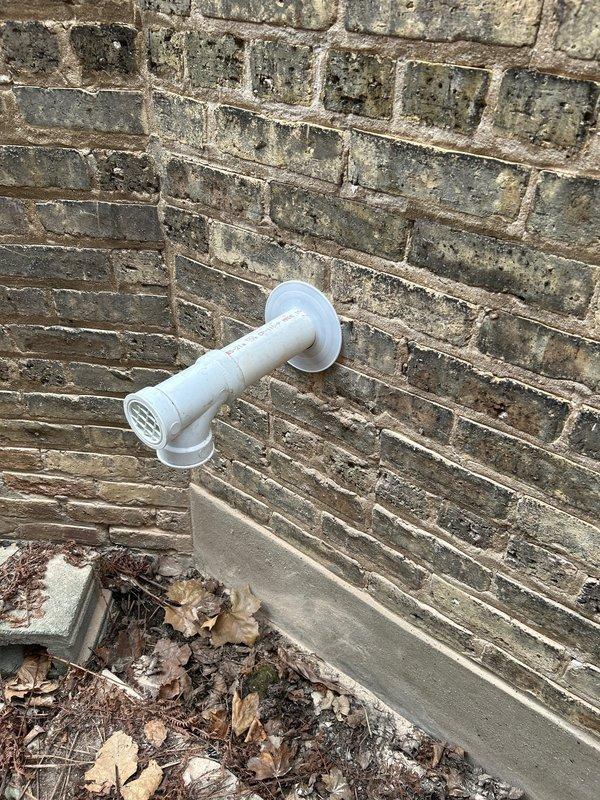 Successfully installed a new tankless water heater system, including proper venting through the existing brick exterior wall using PVC piping with appropriate elbow joints and grid-covered termination. Completed all necessary plumbing connections to the home's existing cast iron and copper pipe infrastructure in the utility area, ensuring proper drainage and code-compliant installation.