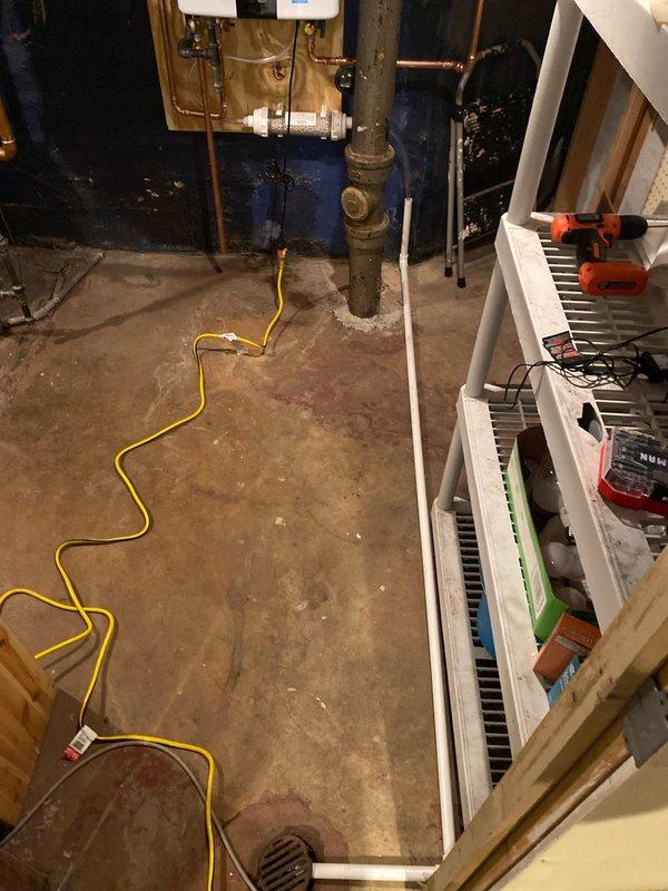 Successfully installed a new tankless water heater system, including proper venting through the existing brick exterior wall using PVC piping with appropriate elbow joints and grid-covered termination. Completed all necessary plumbing connections to the home's existing cast iron and copper pipe infrastructure in the utility area, ensuring proper drainage and code-compliant installation.