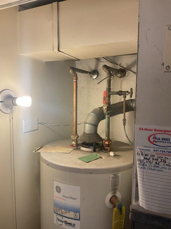 Performed assessment for proactive replacement of existing GE SmartWater unit with recommended 50-gallon Bradford White or Rheem Professional water heater (10-12 year warranty). Estimate includes removal and disposal of current unit, permit/inspection as required by Chicago code, new water supply flex connectors, new gas flex connector, and complete professional installation by licensed and insured technicians.