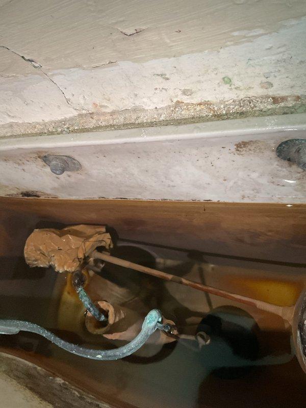 Cleared severe bathroom sink/tub drain clog that homeowner was unable to resolve with consumer products. Inspection revealed significant deterioration of drain pipes, including corrosion, peeling coating, and compromised seals around the drain assembly. Replaced damaged sections and installed new trap assembly to restore proper drainage function while also addressing toilet's running issue by installing new flush valve.