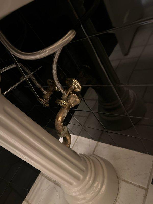 Replaced lavatory faucet in bathroom with black fixtures as per customer request. Connected new faucet to existing braided supply lines and verified proper water flow and drainage through brass P-trap. Tested for leaks and confirmed full functionality without requiring any additional repiping work.