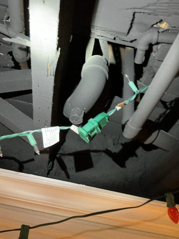 Responded to service call for leaking tankless water heater. Inspected on-demand unit with visible copper connections and shut-off valves. Resolved leak issue and restored proper hot water function. Also performed maintenance on upstairs shower drain using drain rod.