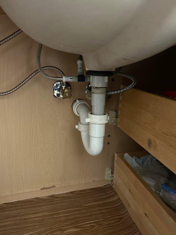 Returned to address previously reported bathroom sink drain issue. Diagnosed malfunctioning pop-up assembly and replaced with new unit. Verified proper operation of drain mechanism after installation.