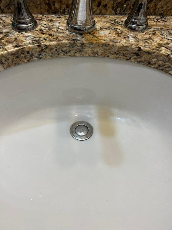 Returned to address previously reported bathroom sink drain issue. Diagnosed malfunctioning pop-up assembly and replaced with new unit. Verified proper operation of drain mechanism after installation.