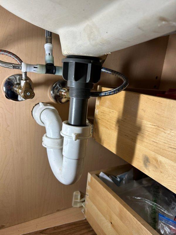 Successfully installed customer-supplied pop-up drain assembly in bathroom sink. Completed full installation with proper connection to existing p-trap and drain system. Verified operation with no leaks upon completion.