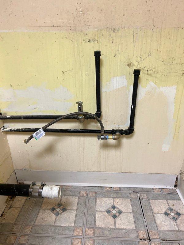 Installed new water shut-off valves for utility sink in basement location per customer request. Accessed existing plumbing configuration on wall, installed valves on water supply lines, and tested functionality to ensure proper operation with no leaks.