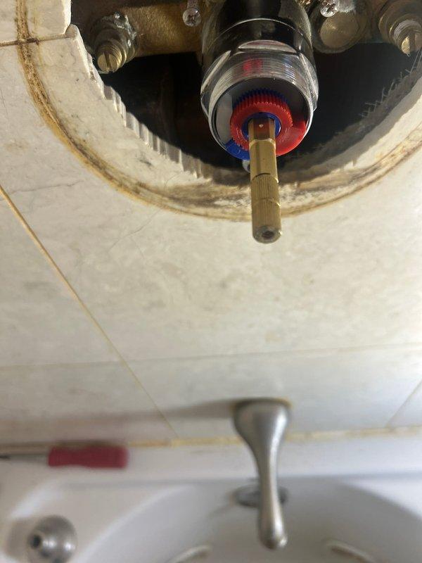 Successfully completed afternoon repair job involving replacement of deteriorated faucet valve assembly. Removed existing brass valve stem with significant corrosion and water damage to surrounding fixture area. Installed new valve assembly with proper hot/cold water indicators, ensuring secure connection to water supply lines and eliminating previous leakage issues.