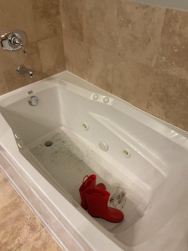 Cleared severe clogging in both shower and bathtub drains using professional-grade snake and drain cleaning solution. Removed accumulated hair, soap residue, and sediment from the drain traps, restoring proper drainage function to both bathroom fixtures.
