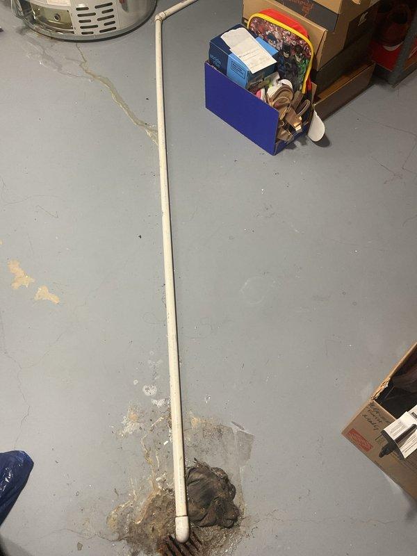 Performed inspection of 75-gallon water heater that is currently operational but exhibiting active leak. Documented damage to flooring at pipe connection point with concrete deterioration evident. Provided customer with multiple replacement options including standard and high-efficiency models.