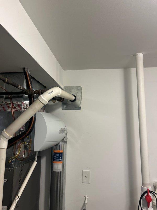 Responded to service call for non-functioning 11-year-old water heater (model R92PRSMA) with no hot water output. Upon inspection of the unit and associated plumbing components in the utility room, diagnosed end-of-life failure requiring replacement. Recommended installation of new water heater to restore hot water service.